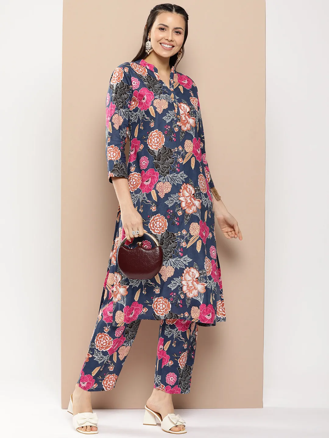 Blue Floral Print Kurta With Blue Floral Print Trousers.